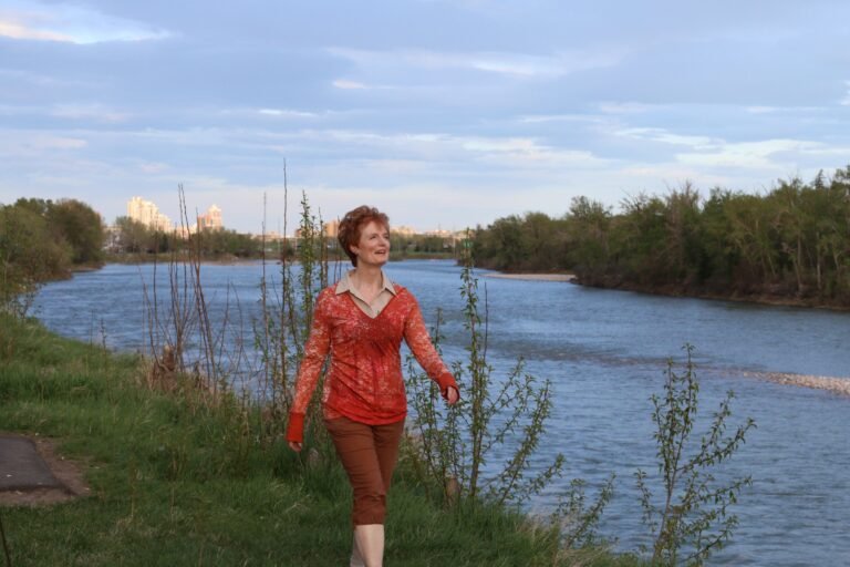 Ida Louise Ridout walking besides Bow river in Calgary